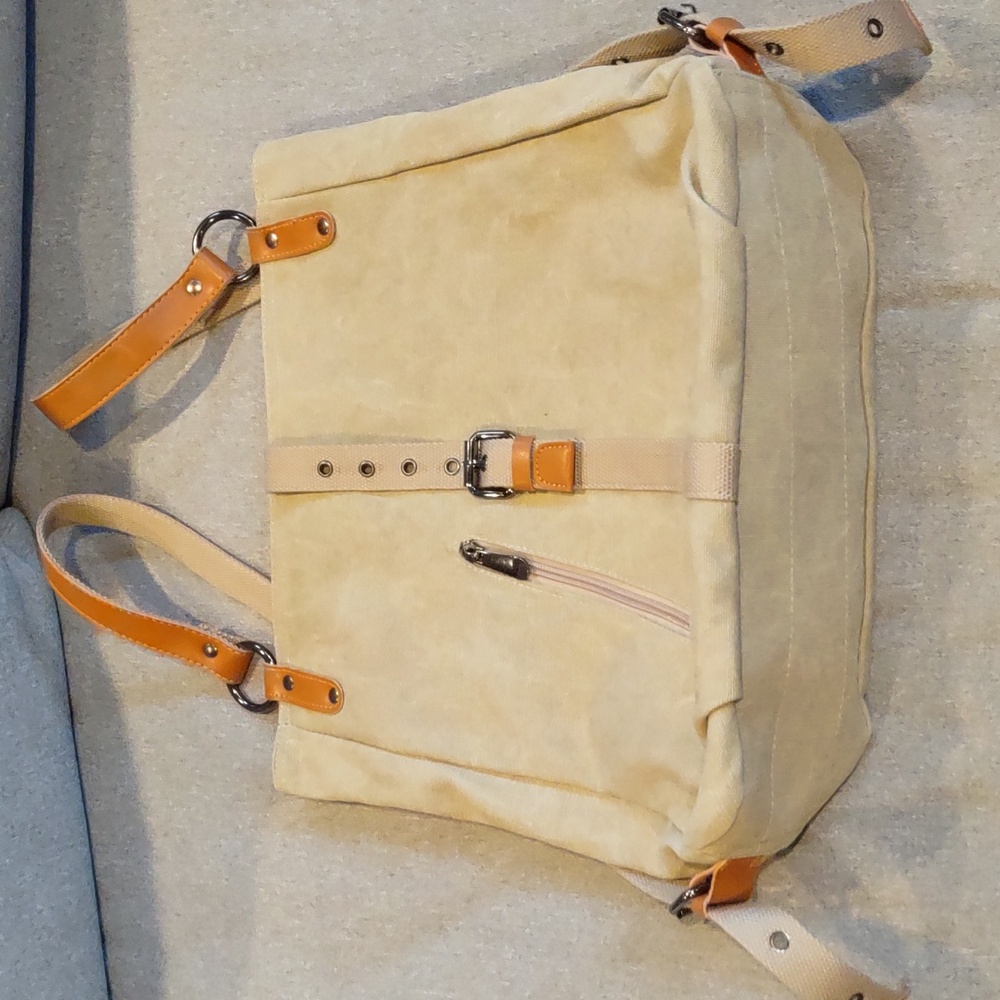 Canvas backpack with Adjustable Straps, zippered pockets. New without tags